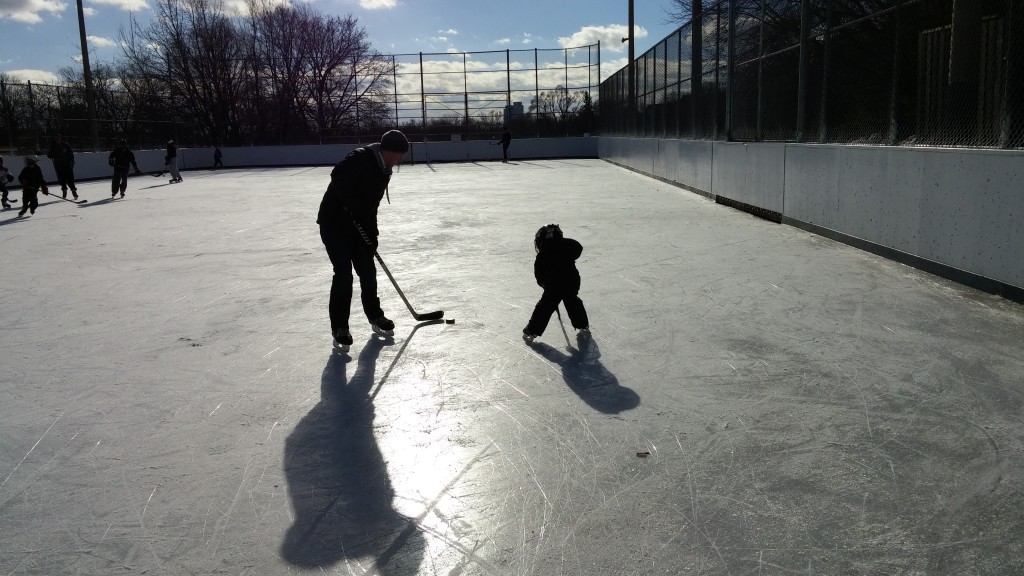dad and son playing hockey