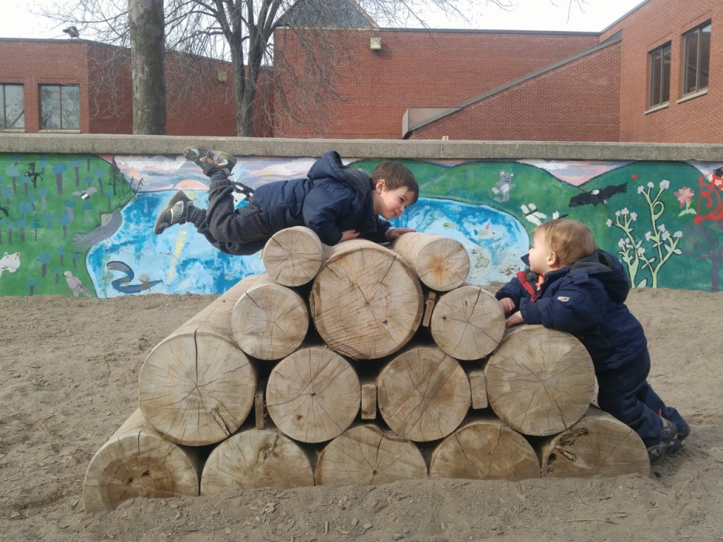 Nate and Ryan on wood logs