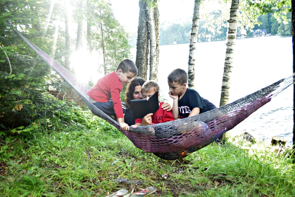 kindle on hammock with boys
